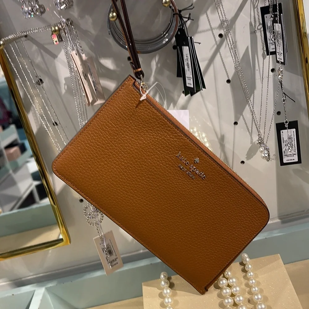 Kate Spade Medium Lucy L-Zip Wristlet Pebble Leather 

Warm Gingerbread 
NWT - Picture 11 of 16